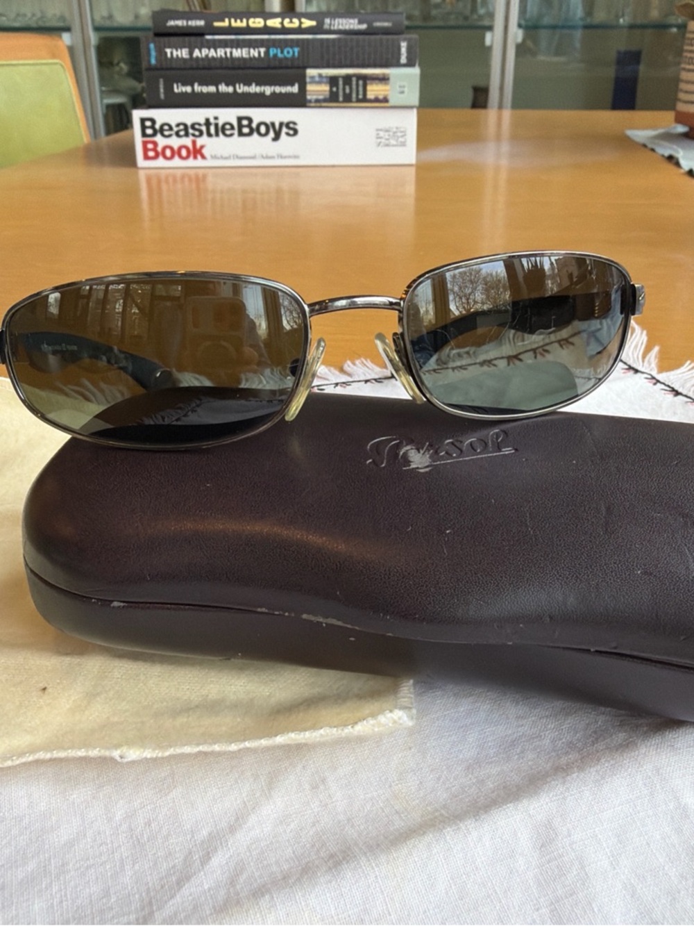 Persol Silver Frame Sunglasses with Green-Tinted Lenses